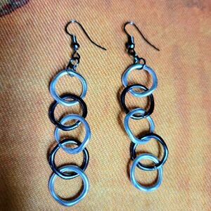 Pair of black and silver tone dangle earrings. Fashion Jewelry. Statement Jewelr
